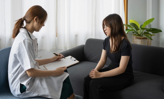Intended mother and father awaiting surrogacy birth